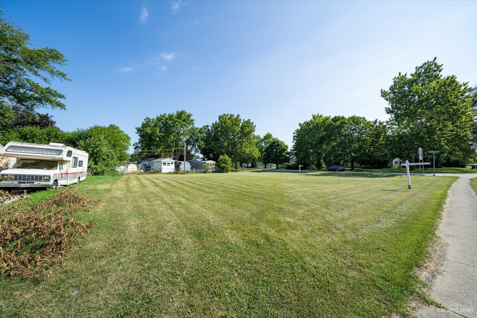 Lot Montgomery Montgomery Road Montgomery, IL 60538 - Photo 2 of 9 a view of a green field with trees