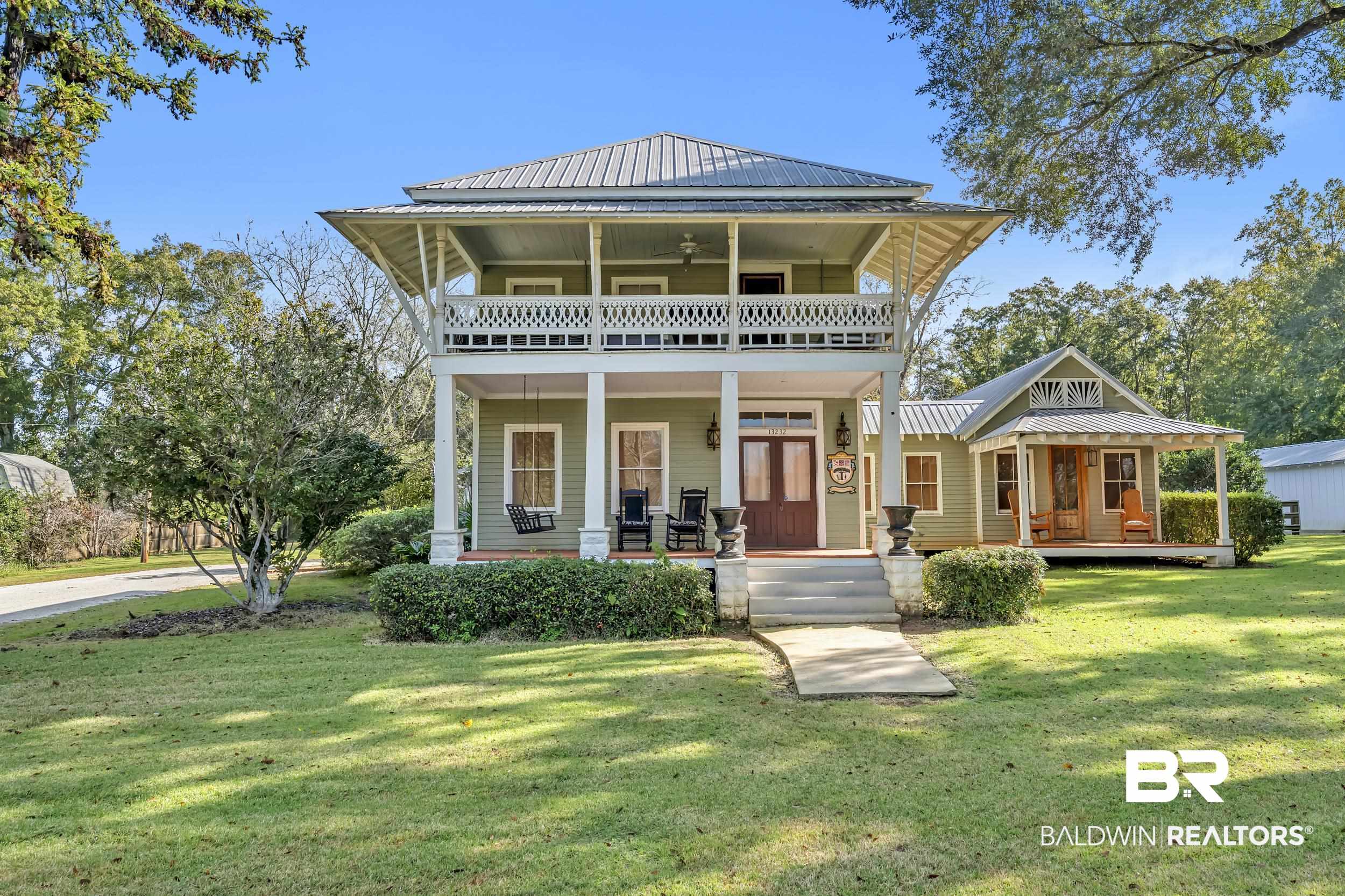 13232 Mary Ann Bch Road Fairhope, AL 36532 - Photo 1 of 79 View of front of property with a porch, a front yard, a metal roof, and ceiling fan