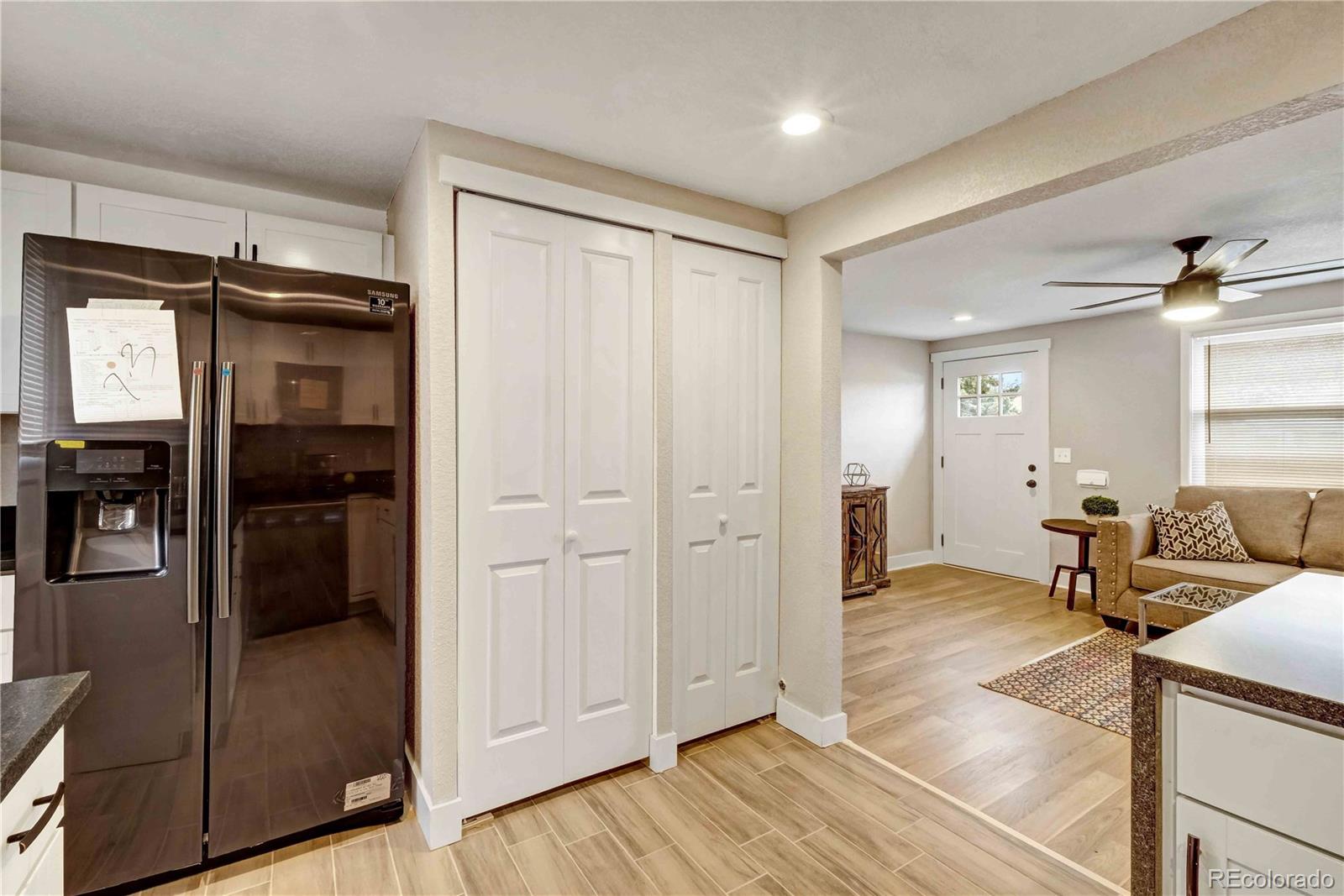 154 South Stuart Street Denver, CO 80219 - Photo 15 of 26 a view of a livingroom with wooden floor and furniture