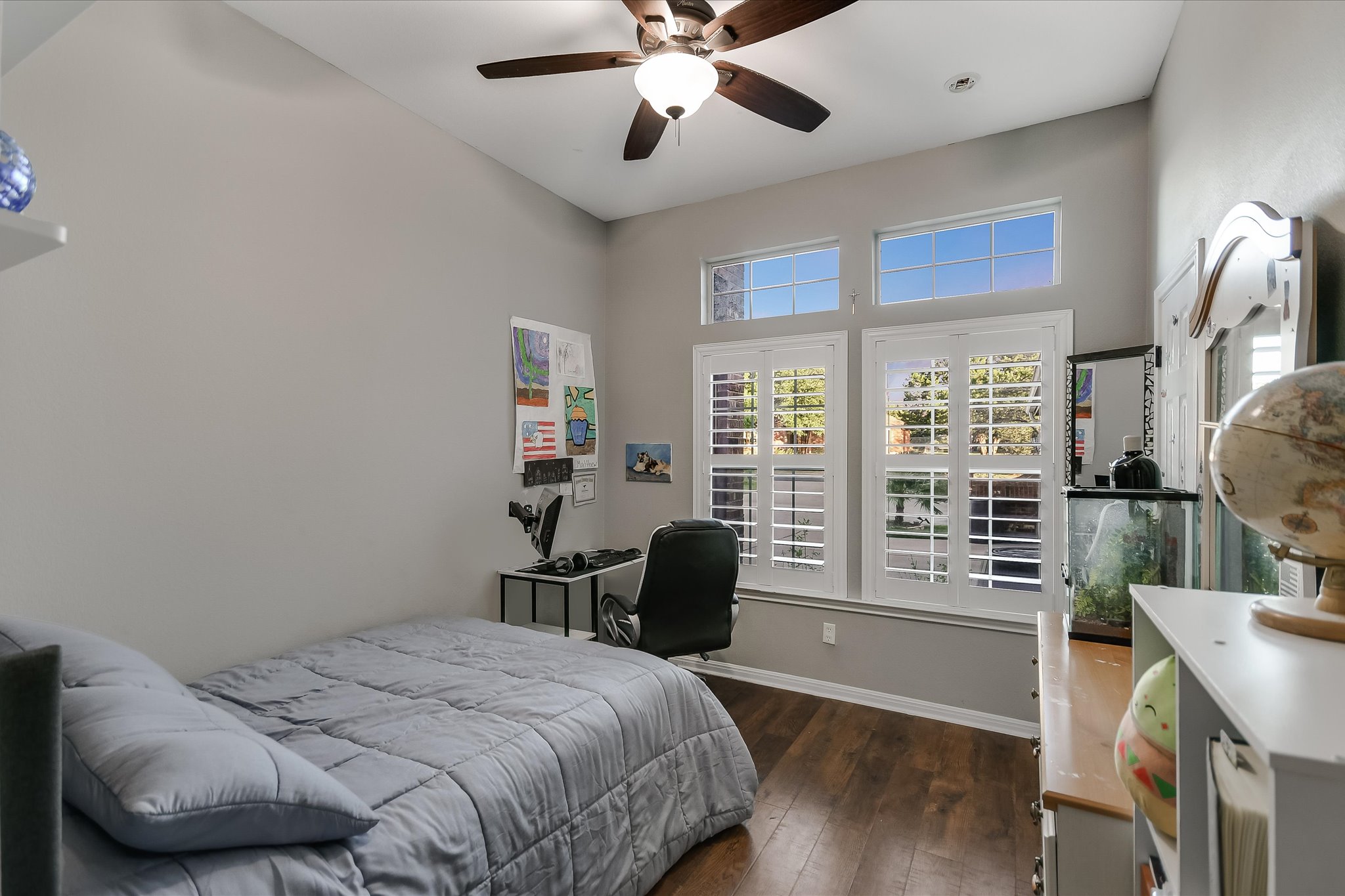 300 Wesley Ridge Drive Spicewood, TX 78669 - Photo 21 of 40 Secondary bedroom #1 with large windows and shutters.