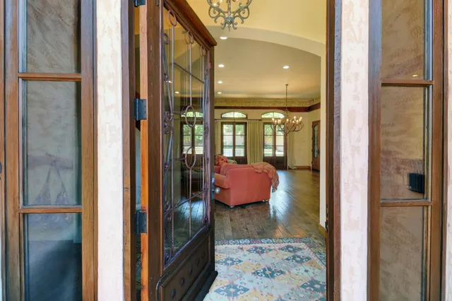 a large kitchen with stainless steel appliances granite countertop a stove and a sink