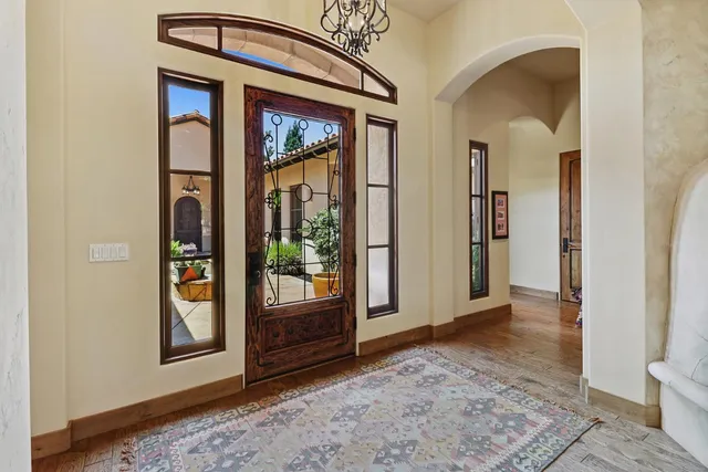 a very nice looking bedroom with a large window
