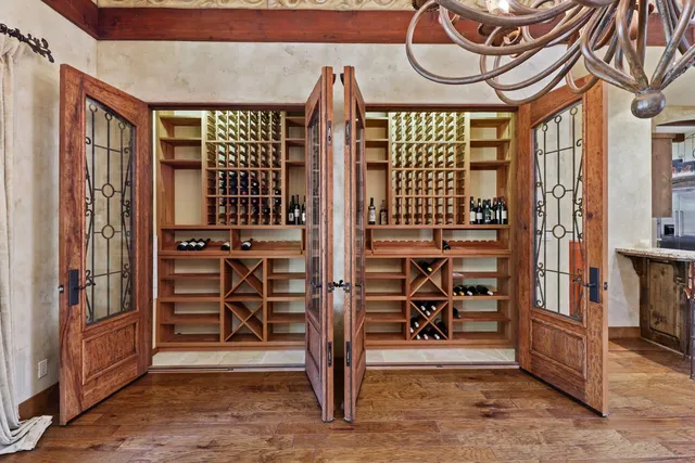 a kitchen with stainless steel appliances granite countertop a stove a refrigerator and a sink