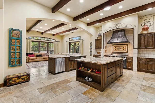 a spacious bedroom with a bed and a large window