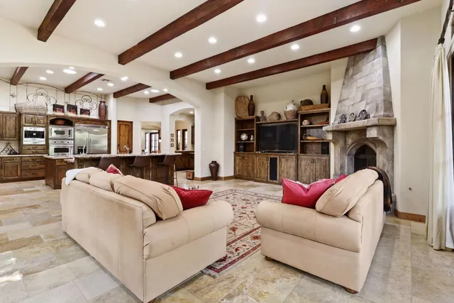 a en suite spacious bathroom with a double vanity sink a large mirror and a bathtub