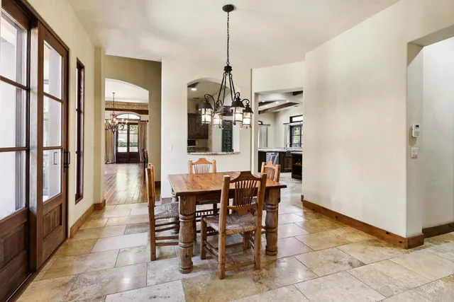 a view of a house with pool and sitting area