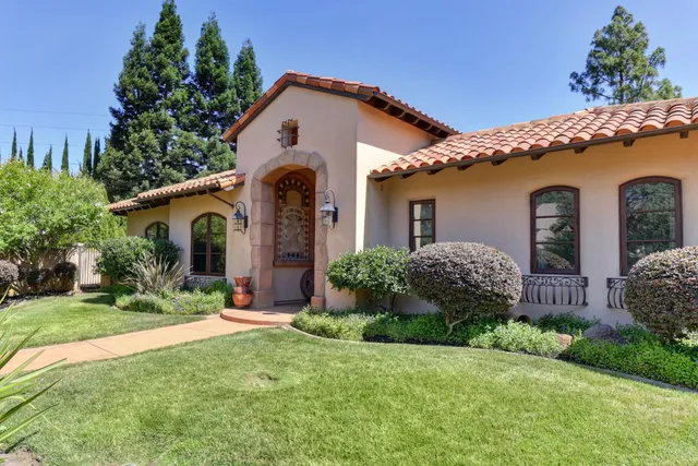 a front view of a house with garden