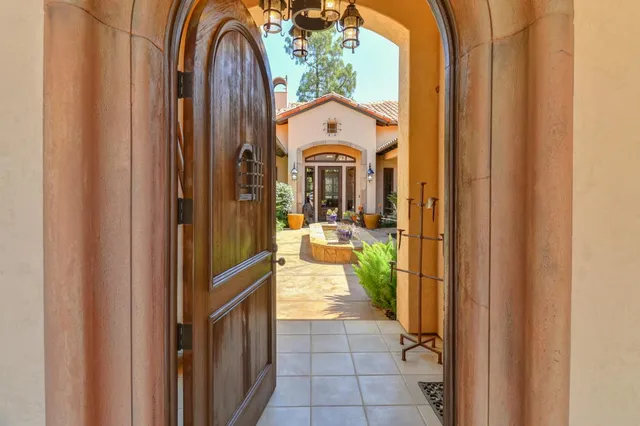 a living room with furniture fireplace and flat screen tv