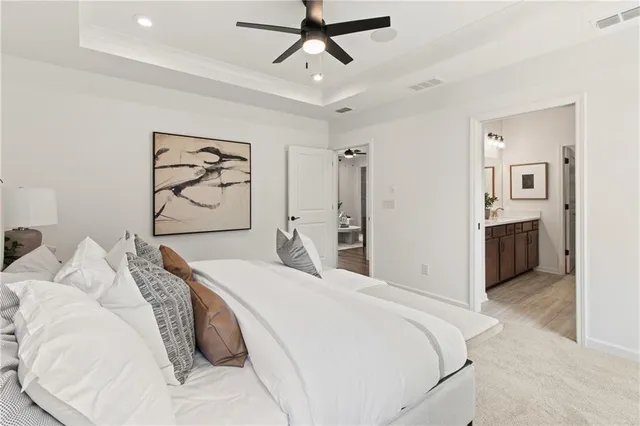 a bathroom with a shower sink and mirror