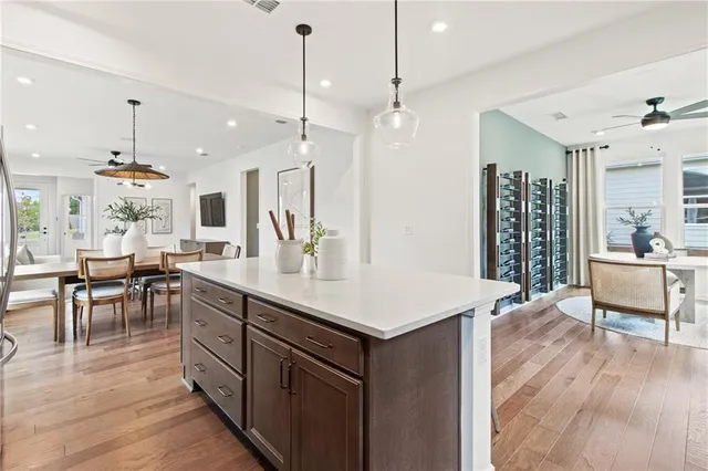 a view of a dining room with furniture wooden floor and chandelier