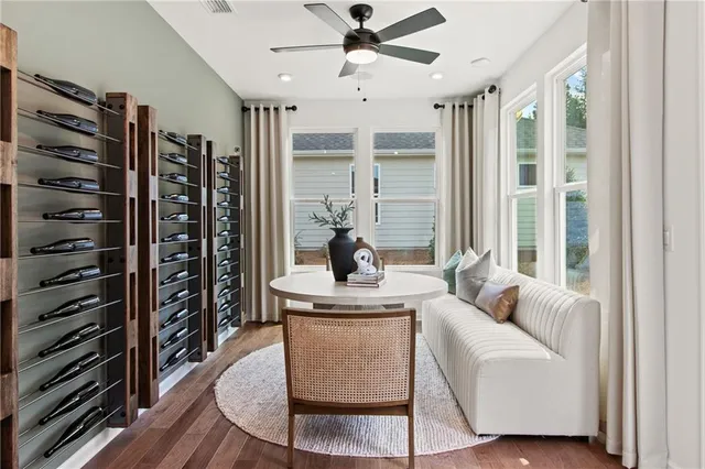 a dining room with furniture a window and wooden floor
