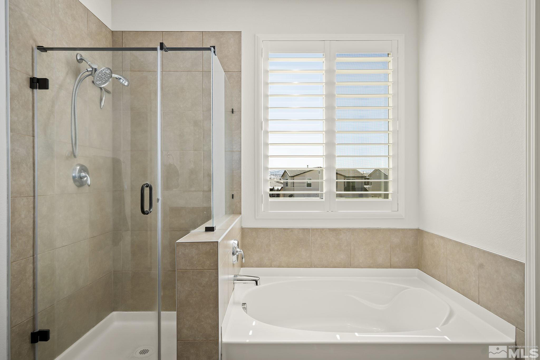 2860 Bonfire Lane Reno, NV 89521 - Photo 15 of 25 a bathroom with a bathtub and shower