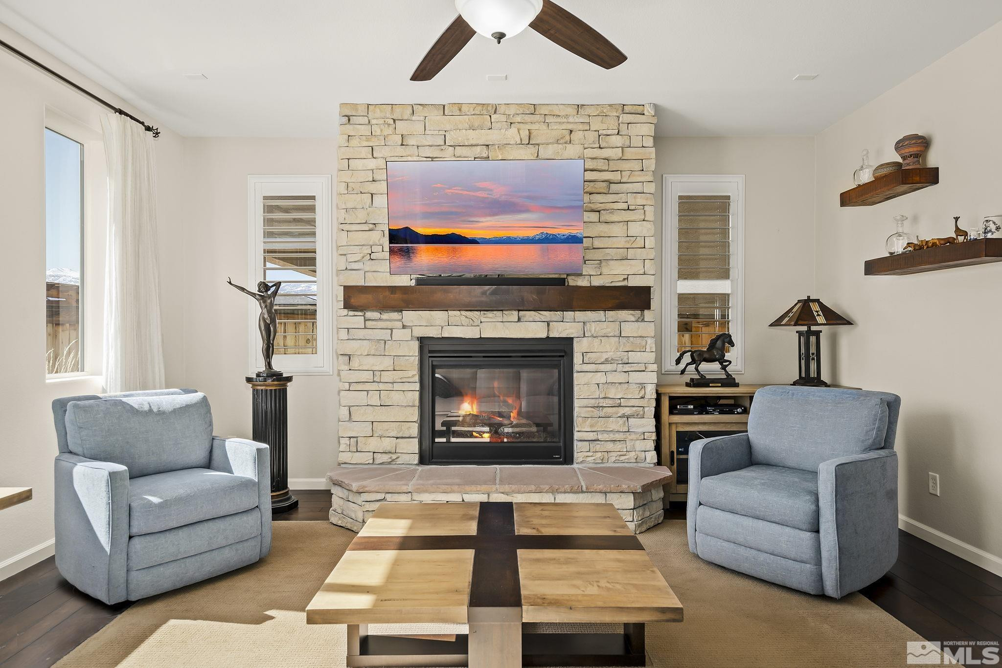 2860 Bonfire Lane Reno, NV 89521 - Photo 4 of 25 a living room with furniture a flat screen tv and a fireplace