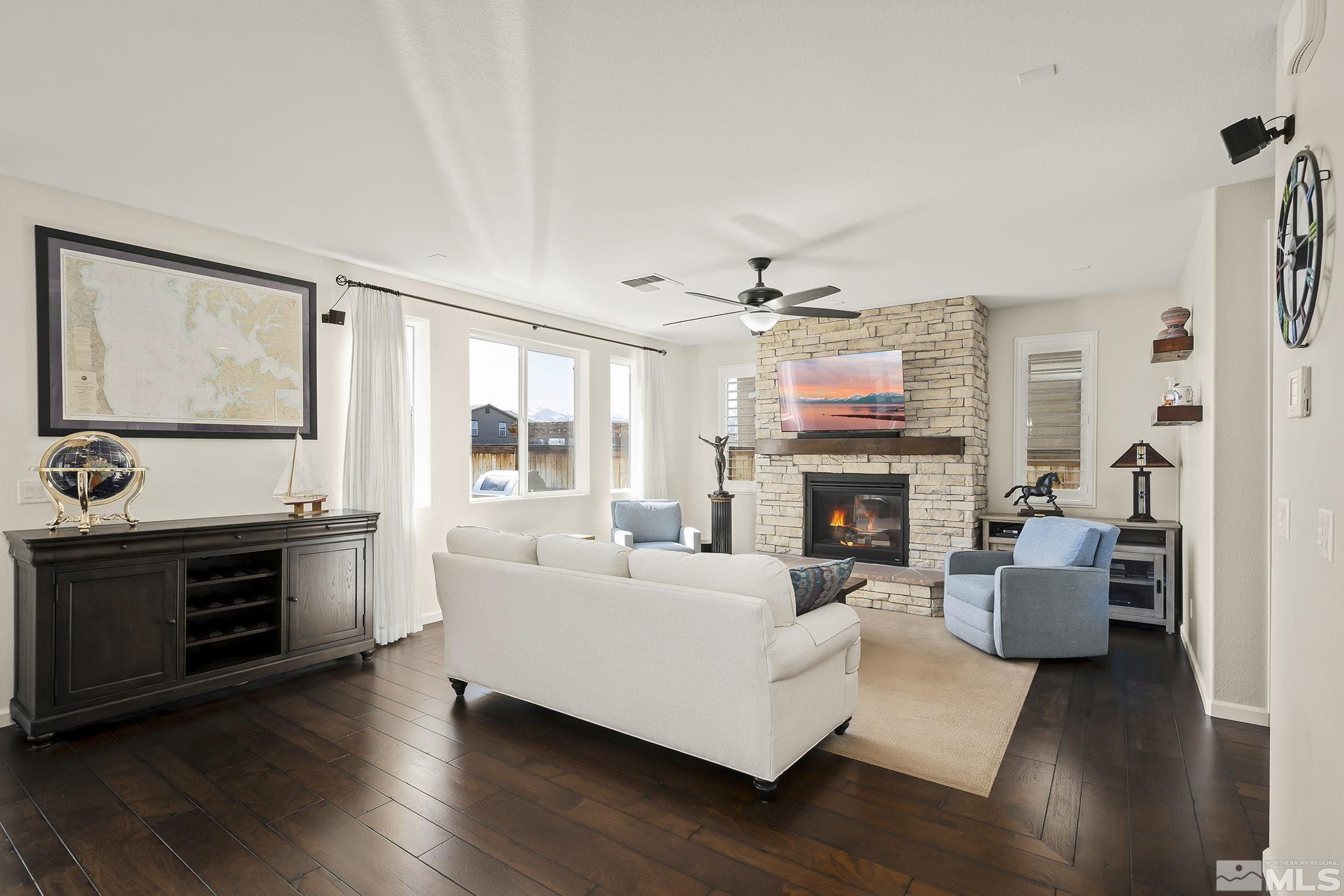 2860 Bonfire Lane Reno, NV 89521 - Photo 5 of 25 a living room with furniture large window and fireplace