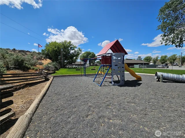 a view of a tiny house with a yard