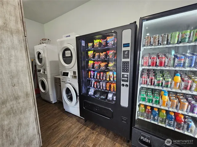 a kitchen with a sink appliances and cabinets