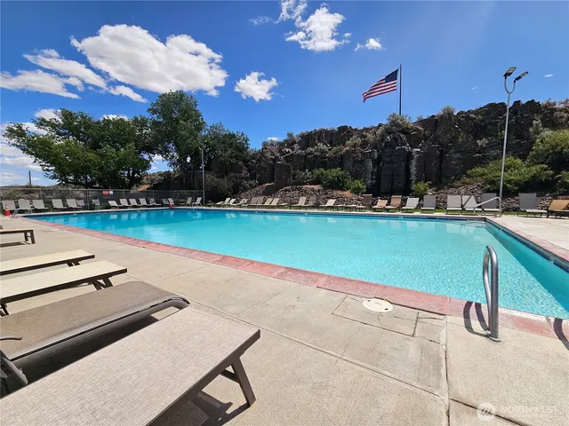 a view of a porch with a table and a chair
