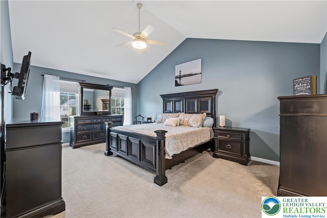 13 Country Road Northampton, PA 18067 - Photo 48 of 71 Step into comfort with this bedroom, featuring vaulted ceilings and a classic ceiling fan for optimal airflow.