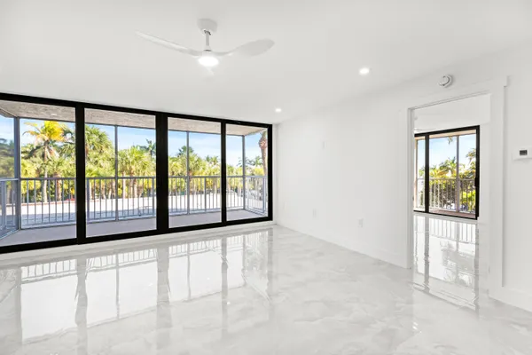 a view of an empty room with a window