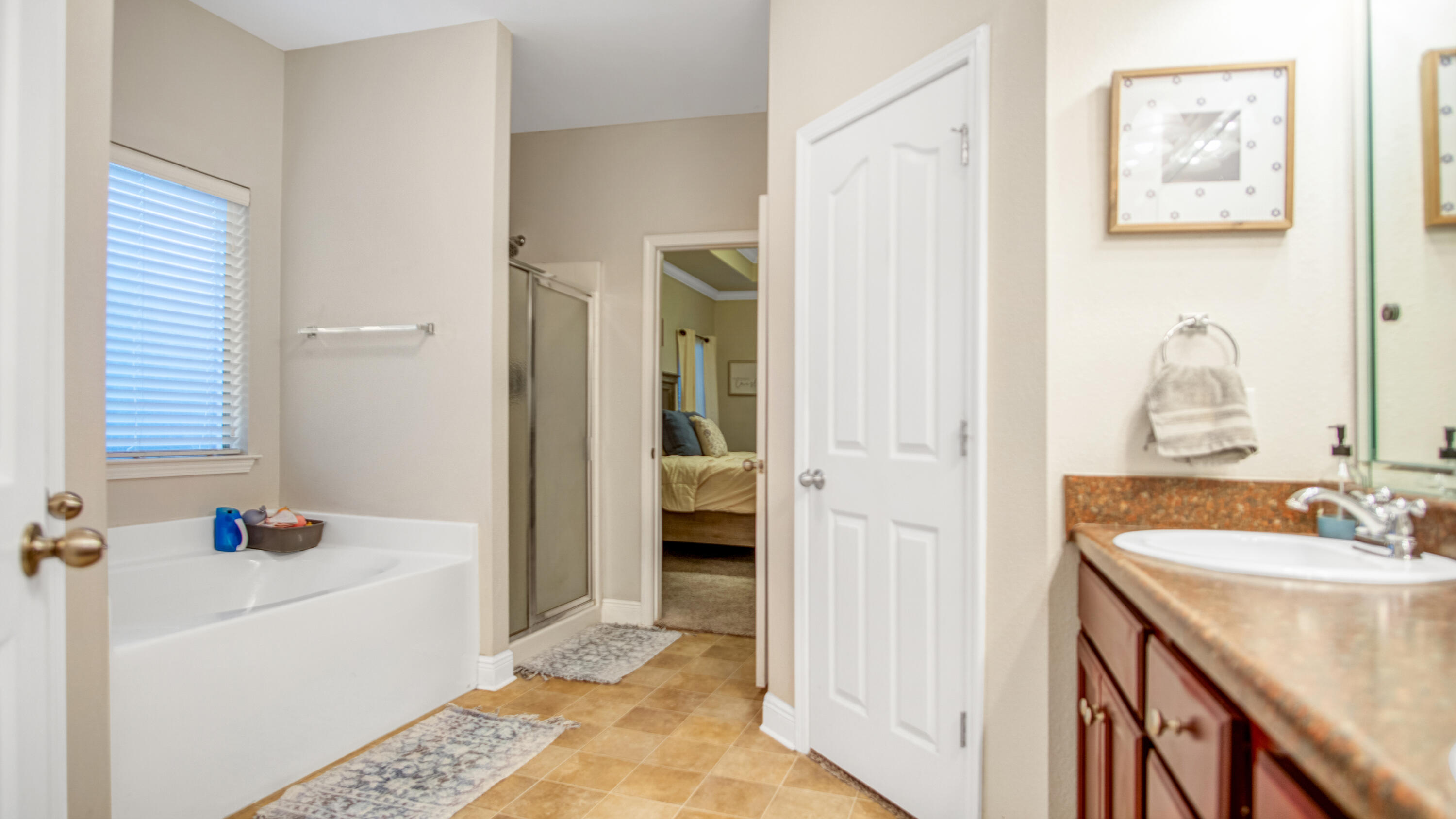 744 Lime Lane Crestview, FL 32536 - Photo 19 of 33 a bathroom with a tub sink and a mirror