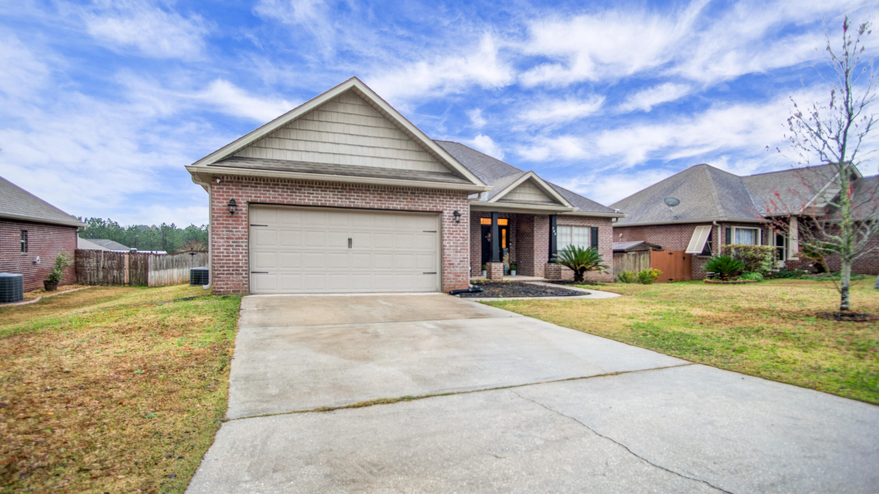 744 Lime Lane Crestview, FL 32536 - Photo 2 of 33 a front view of a house with a yard
