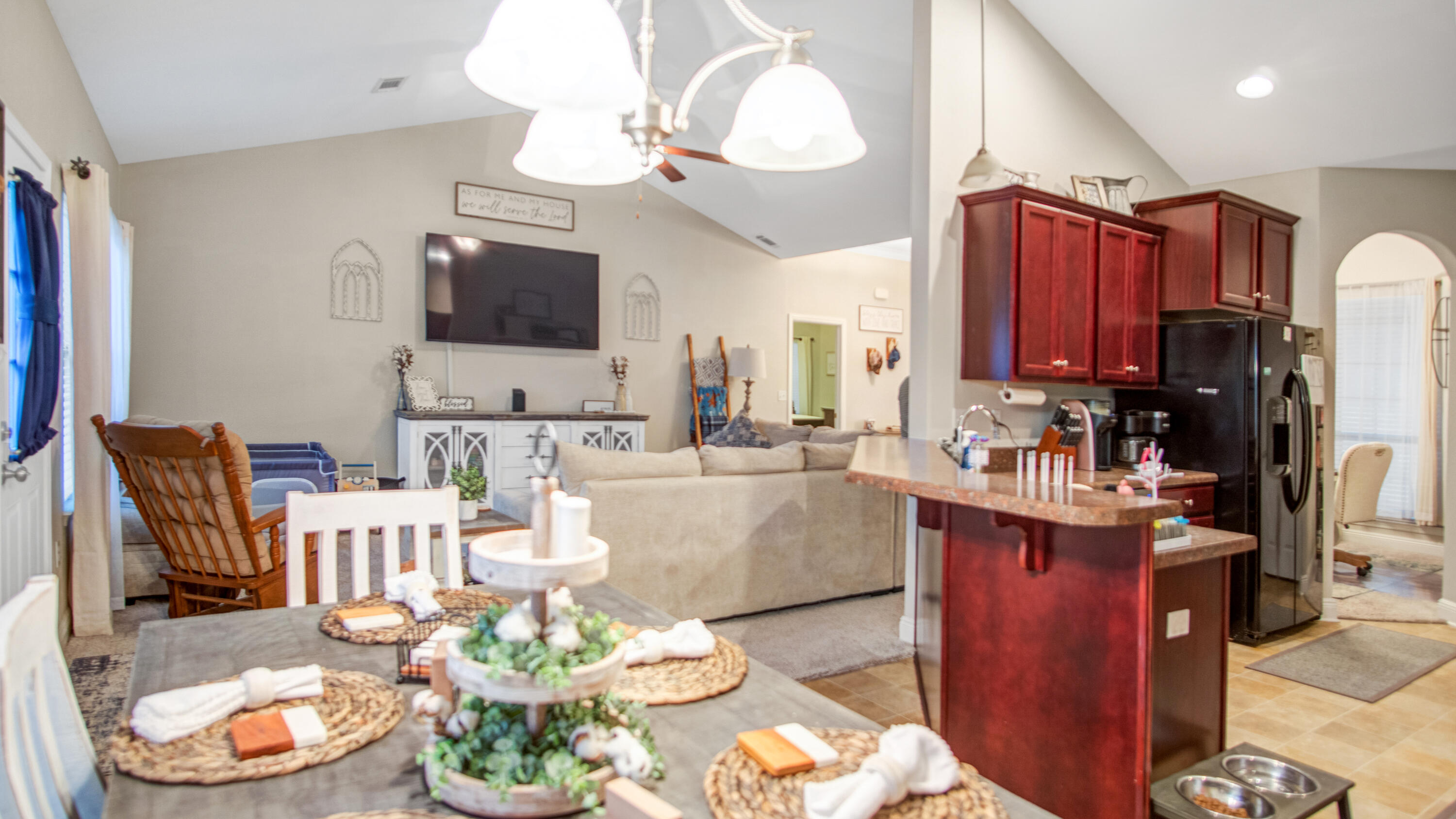 744 Lime Lane Crestview, FL 32536 - Photo 24 of 33 a living room with kitchen island furniture and a flat screen tv