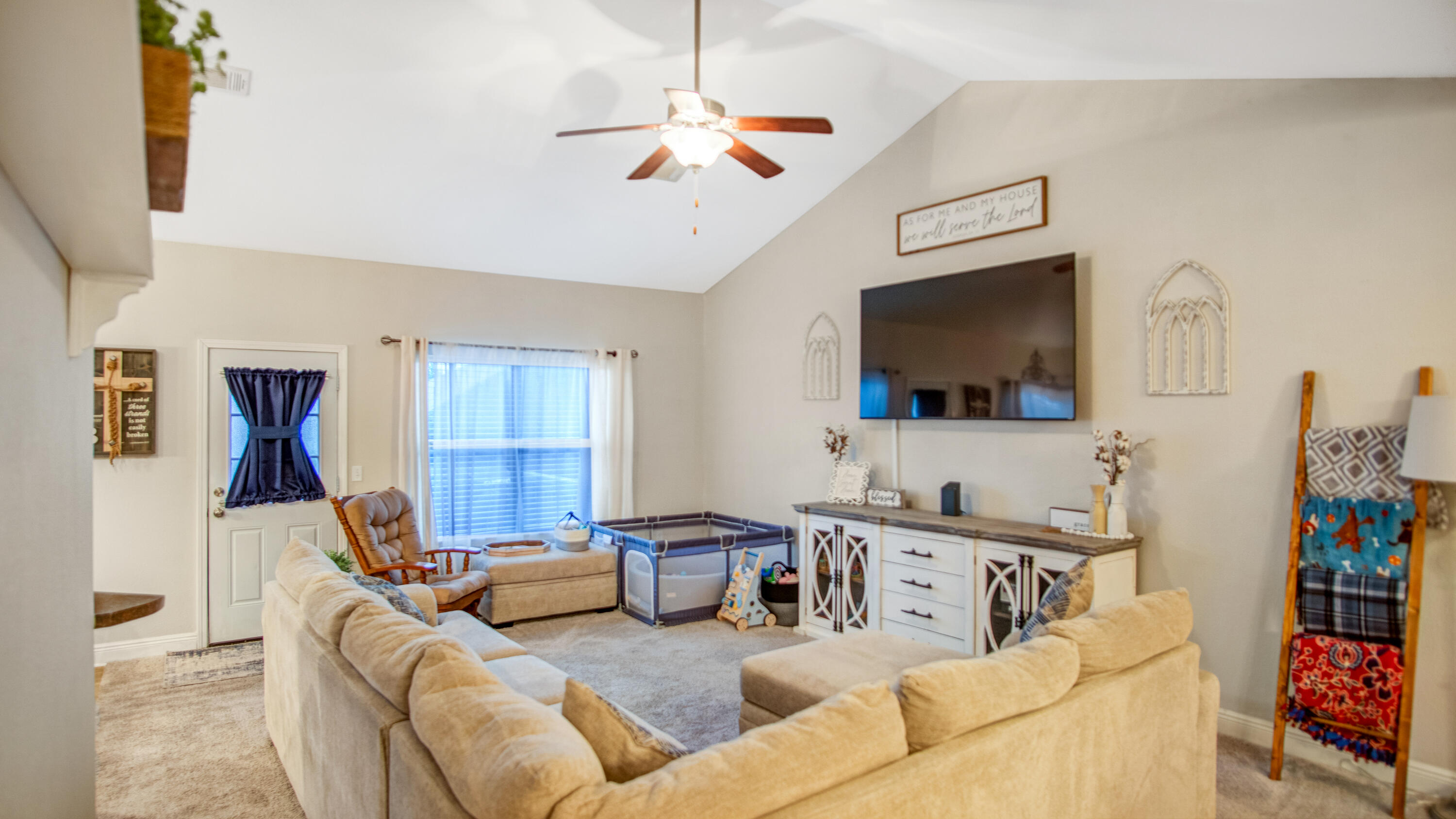 744 Lime Lane Crestview, FL 32536 - Photo 7 of 33 a living room with furniture and a flat screen tv