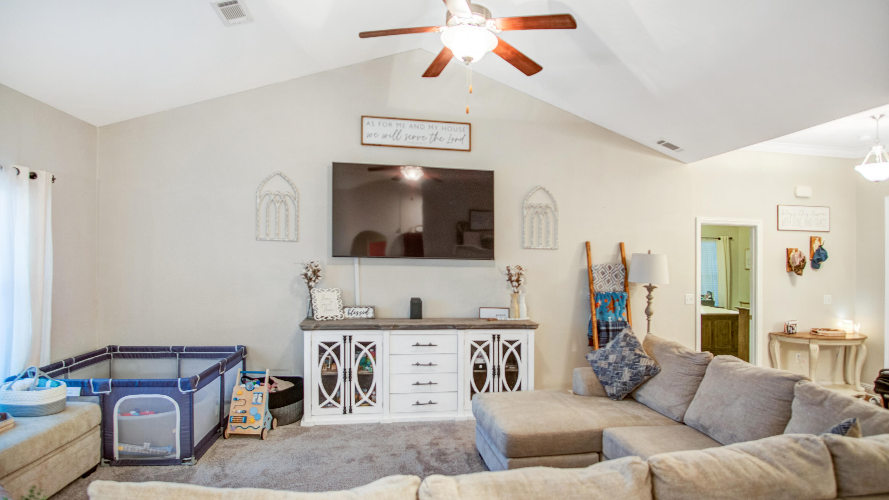 744 Lime Lane Crestview, FL 32536 - Photo 8 of 33 a living room with furniture and a flat screen tv