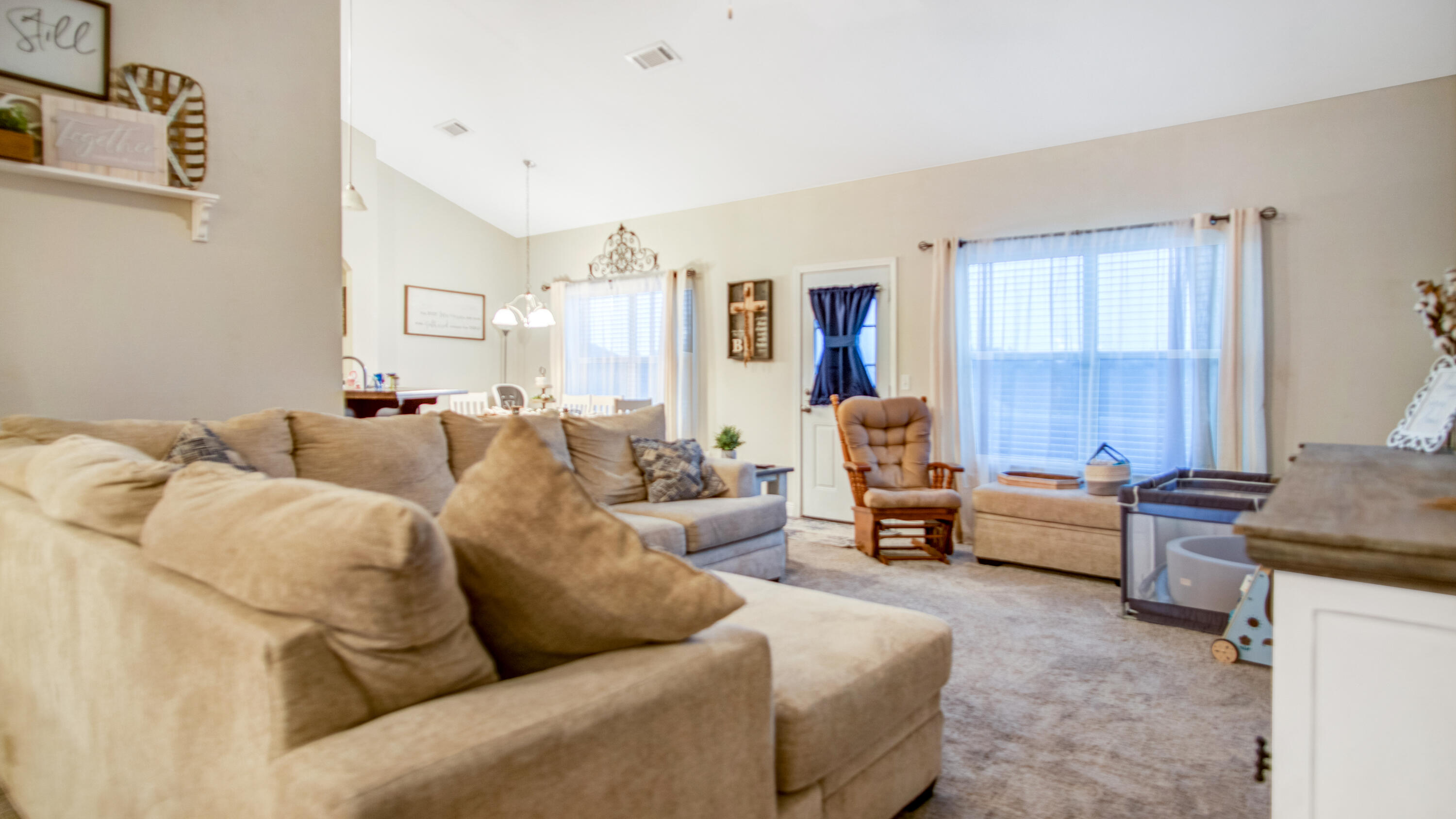 744 Lime Lane Crestview, FL 32536 - Photo 9 of 33 a living room with furniture and a large window