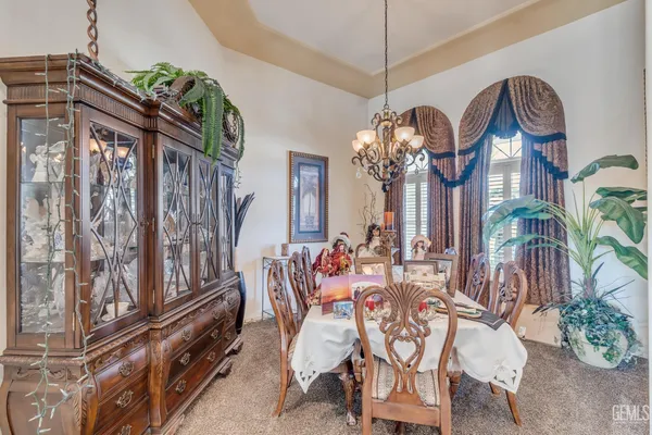 a kitchen with stainless steel appliances kitchen island granite countertop a sink and cabinets