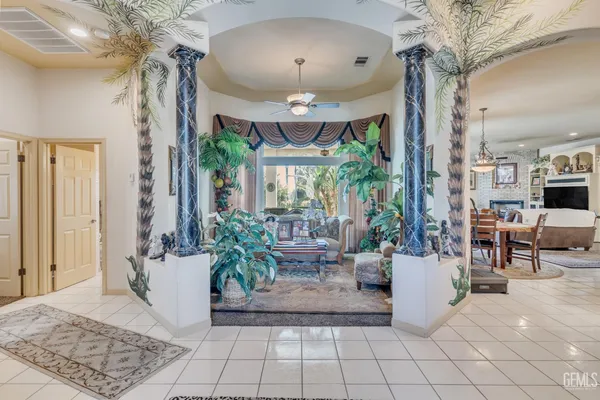 a kitchen with white cabinets and appliances