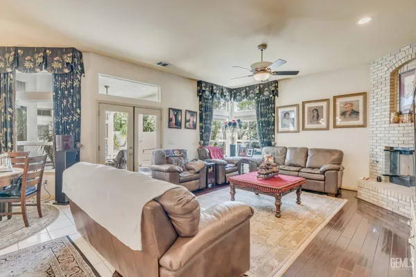 a view of a dining room with furniture and chandelier