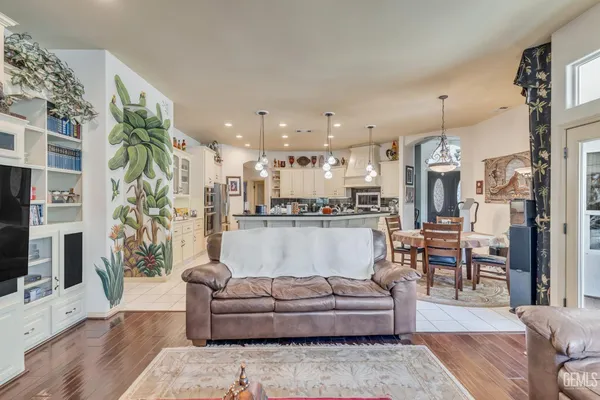 a bathroom with a granite countertop shower a sink and a large mirror