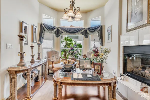 a living room with furniture and a book shelf
