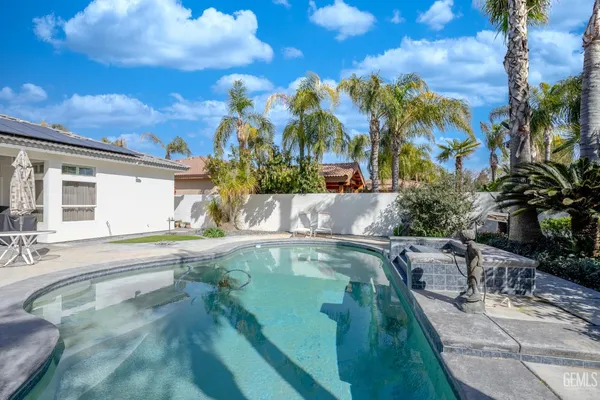 a view of a park with large trees