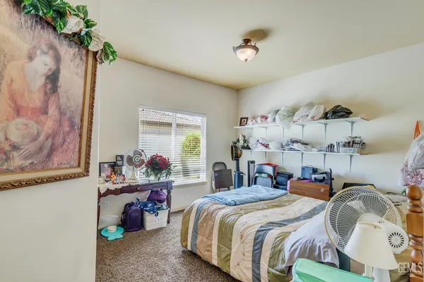 a bathroom with a sink vanity granite tub and shower