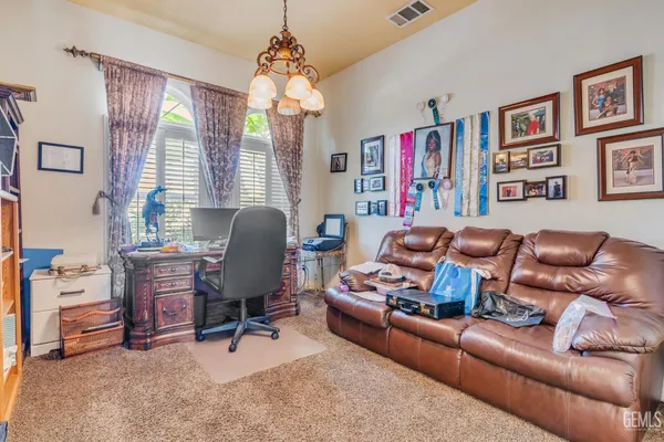 an aerial view of a house with a garden and plants