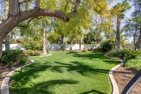 a view of a swimming pool with a garden