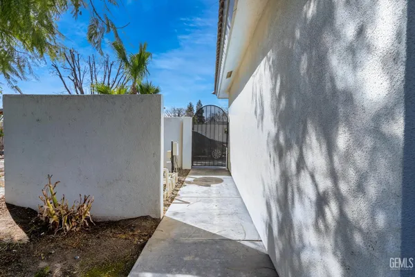 a view of a house with potted plants
