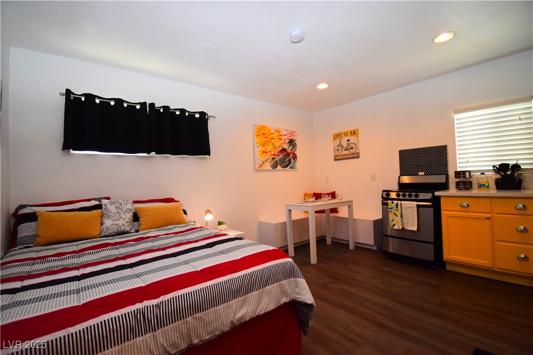 308 North 10th Street, Unit B Las Vegas, NV 89101 - Photo 11 of 17 Bedroom with dark wood finished floors and recesse