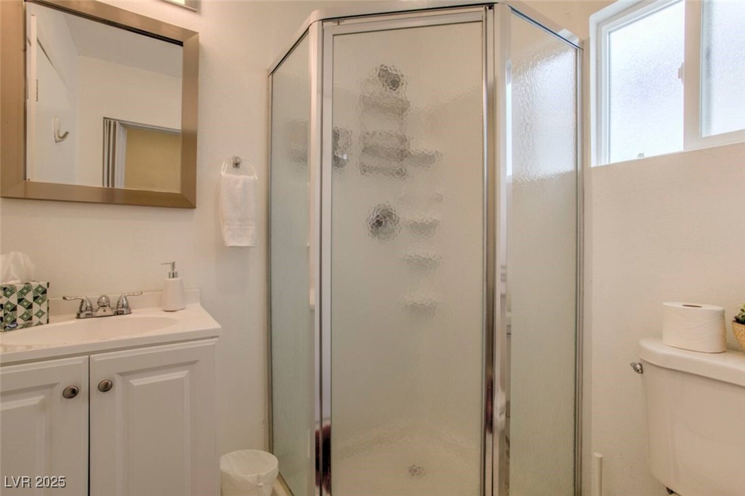 308 North 10th Street, Unit B Las Vegas, NV 89101 - Photo 13 of 17 Full bath featuring a shower stall and vanity