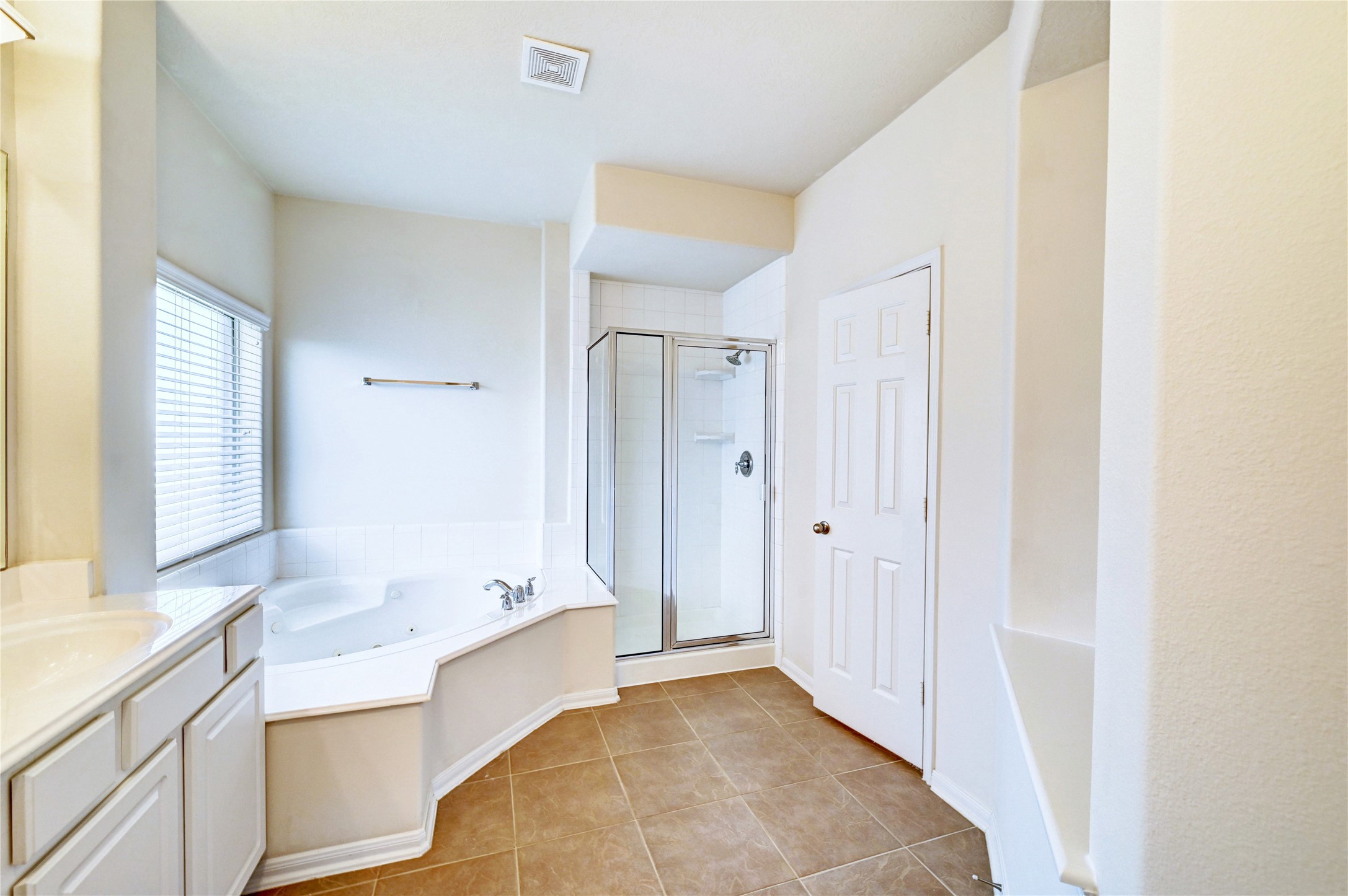 24818 Corbin Gate Drive Spring, TX 77389 - Photo 13 of 49 a bathroom with a tub sink and mirror