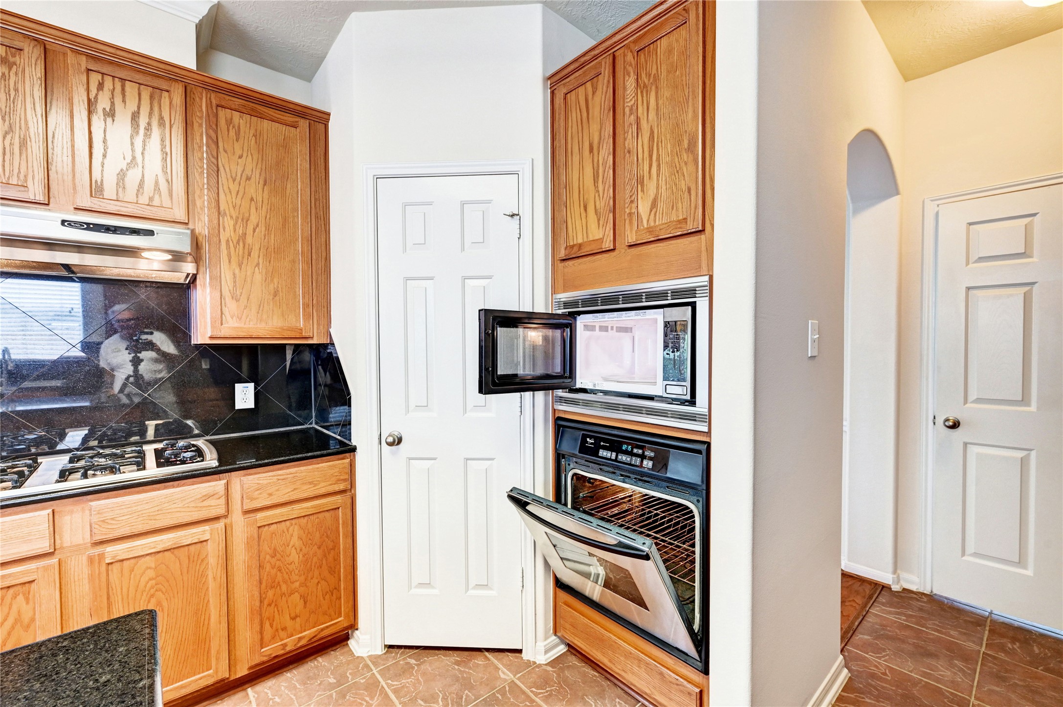 24818 Corbin Gate Drive Spring, TX 77389 - Photo 21 of 49 a kitchen with stainless steel appliances granite countertop a refrigerator and cabinets