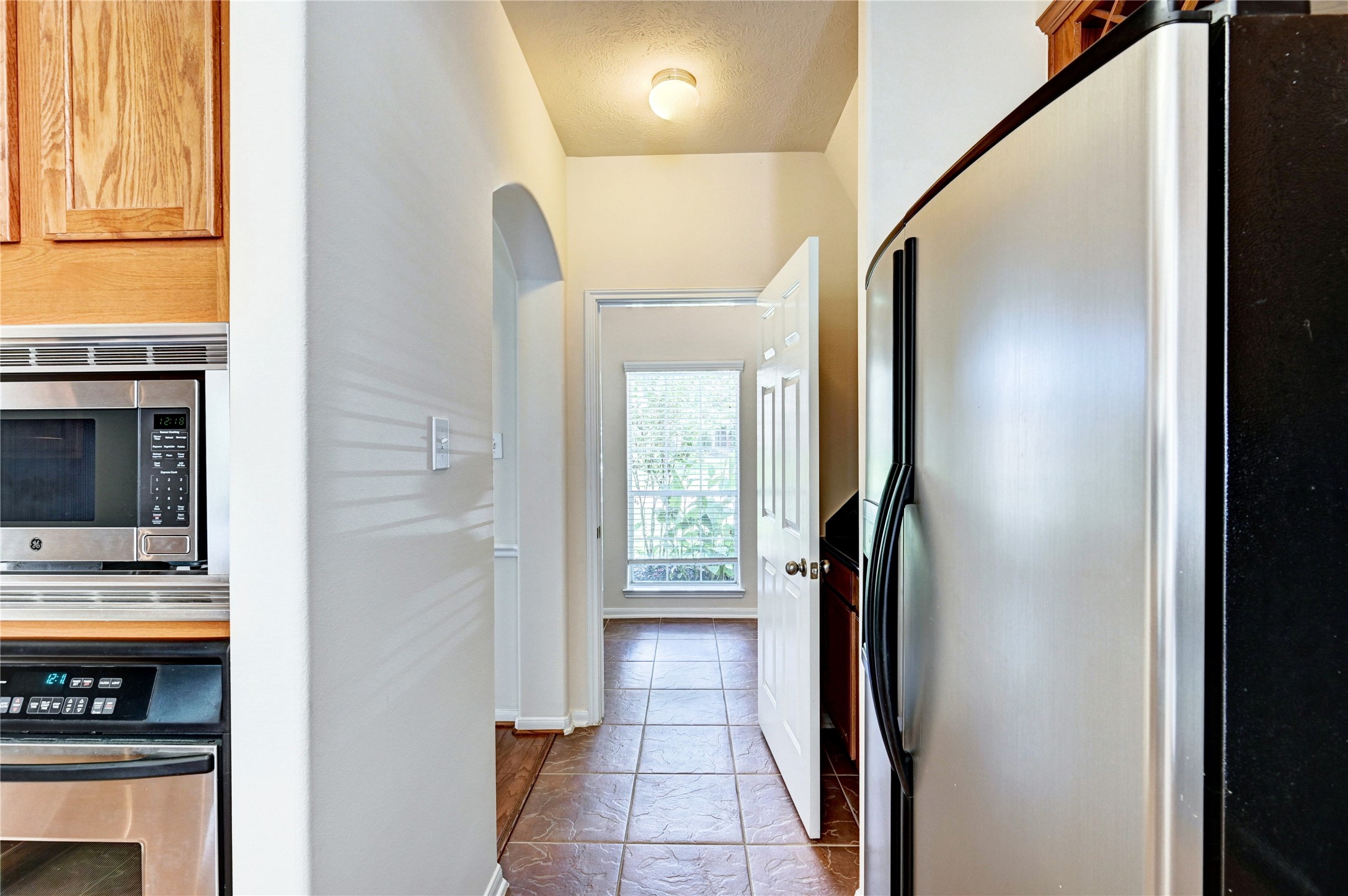 24818 Corbin Gate Drive Spring, TX 77389 - Photo 22 of 49 a view of hallway with stairs and wooden floor