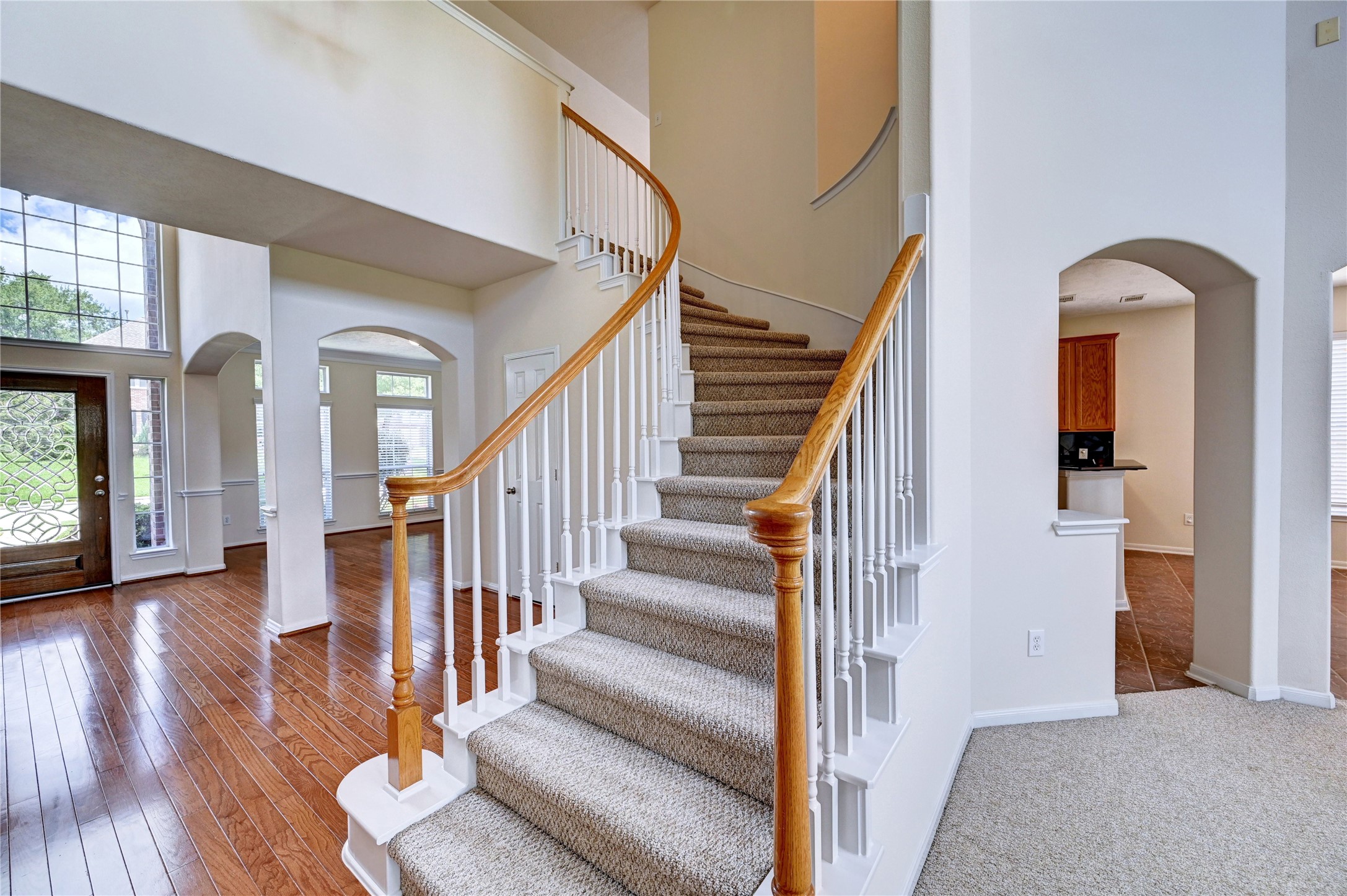 24818 Corbin Gate Drive Spring, TX 77389 - Photo 28 of 49 a view of staircase with wooden floor and a large window