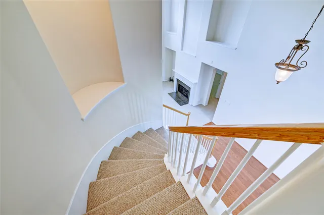 a view of an entryway with a floor to ceiling window and a living room