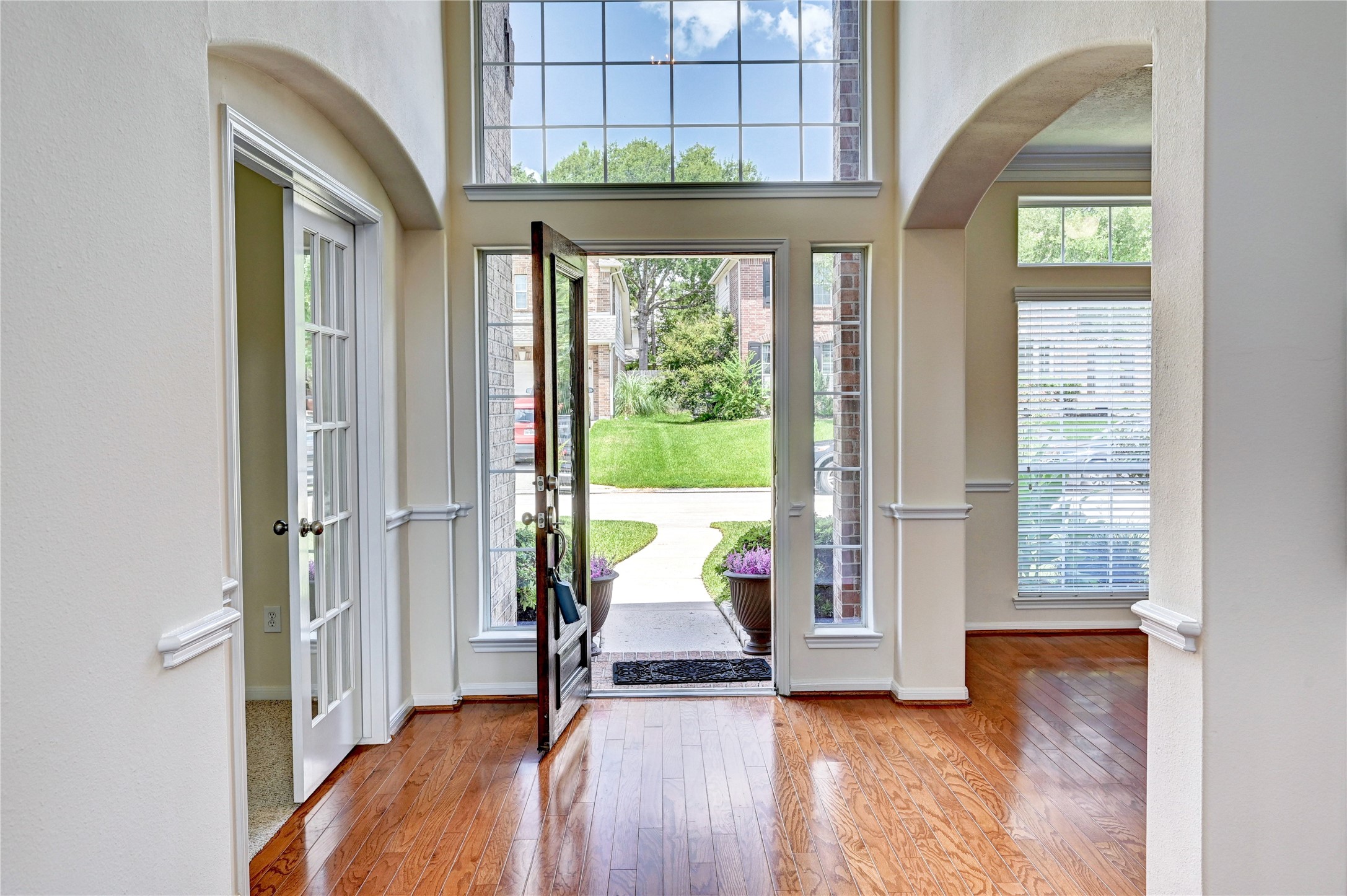 24818 Corbin Gate Drive Spring, TX 77389 - Photo 40 of 49 a view of an entryway with a floor to ceiling window and a living room
