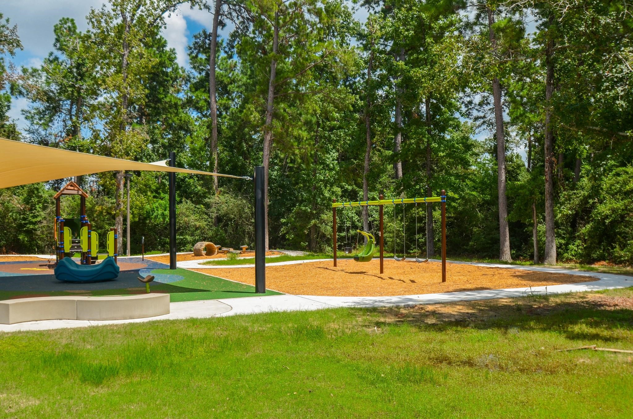 24818 Corbin Gate Drive Spring, TX 77389 - Photo 46 of 49 a view of a yard with a slide