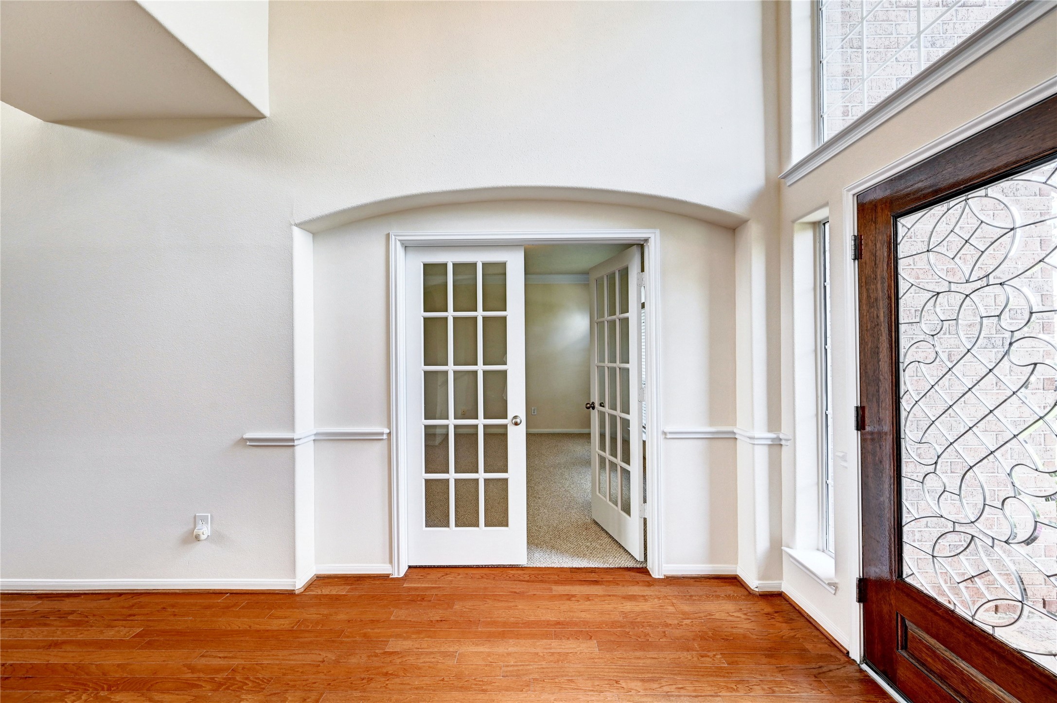 24818 Corbin Gate Drive Spring, TX 77389 - Photo 5 of 49 a view of an empty room with wooden floor and a window