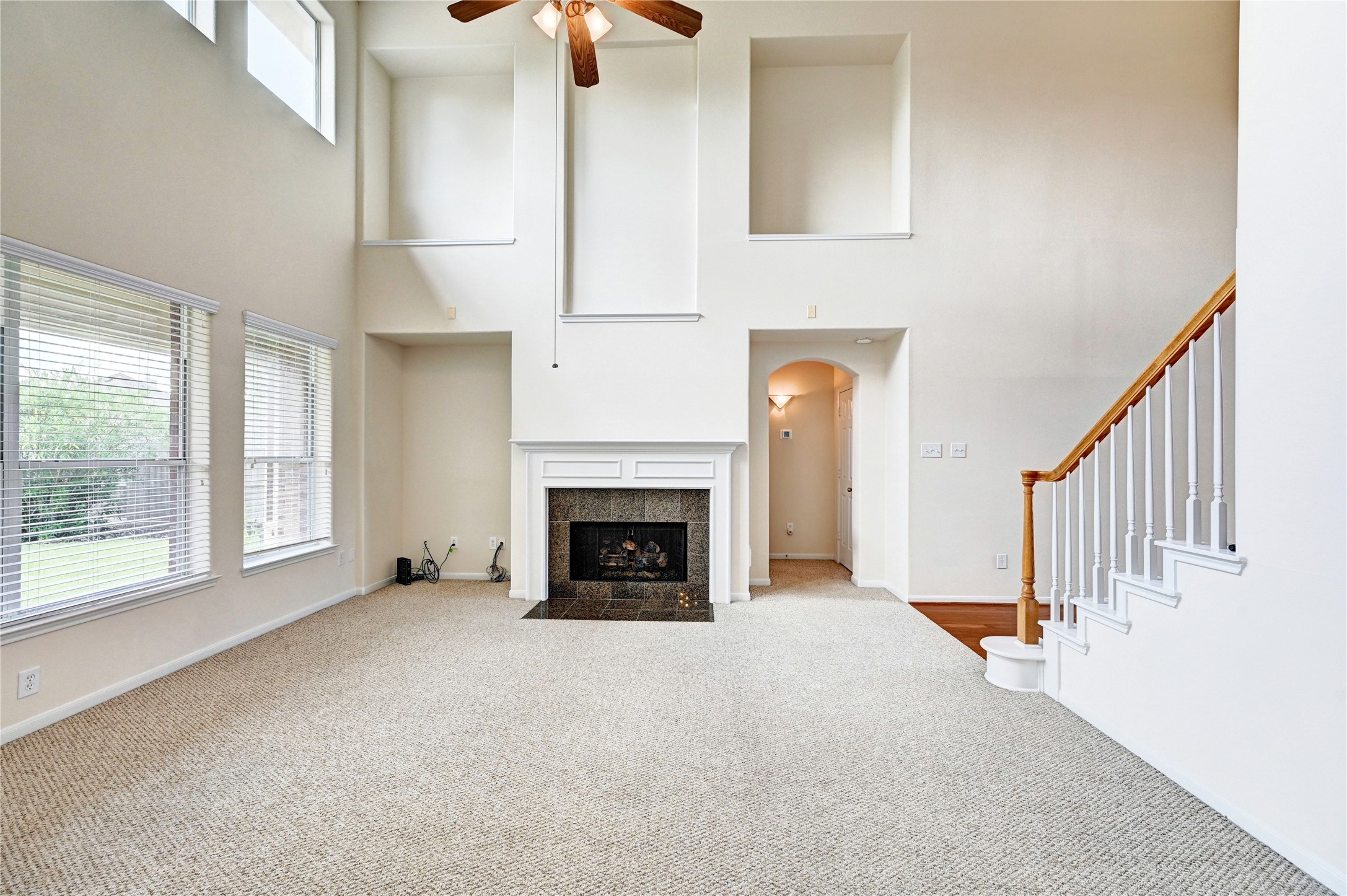 24818 Corbin Gate Drive Spring, TX 77389 - Photo 10 of 49 a view of an empty room with window and fire place